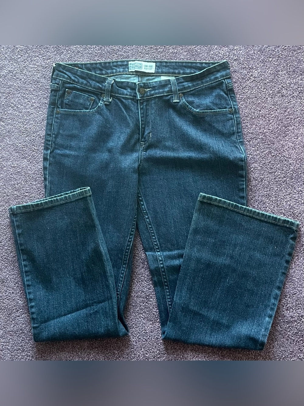 Women’s signature Levi Strauss low boot leg jeans. Size 12